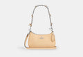 COACH® Women's Minibolso Cruzado Teri Con Lazos en Beige | Cuir