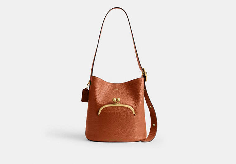 COACH® Women's Bolso Bucket Bleecker Con Cierre De Boquilla en Castaño | Cuir