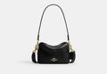 COACH® Women's Minibolso Cruzado Carey en Negro | Cuir