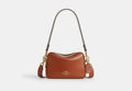 COACH® Women's Minibolso Cruzado Carey en Castaño | Cuir