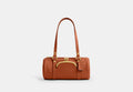 COACH® Women's Bolso Kisslock Barrel 28 en Castaño | Cuir