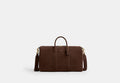 COACH® Unisex Bolso Compass 45 en Castaño | Daim
