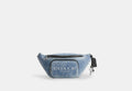 COACH® Men's Riñonera Travis 35 En Tela Vaquera Exquisita Con Charms en Azul | Cuir