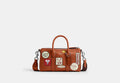 COACH® Unisex Bolso Compass 25 Con Parches Coach | Brain Dead en Castaño | Cuir