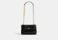 COACH® Women's Bolso Cruzado Elodie 18 Con Acolchado en Negro | Cuir