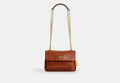 COACH® Women's Bolso Cruzado Elodie 18 Con Acolchado en Castaño | Cuir