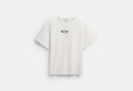 COACH® Men's Camiseta De Algodón Orgánico Con Cabeza Coach | Brain Dead en Blanco, Talla Mediano