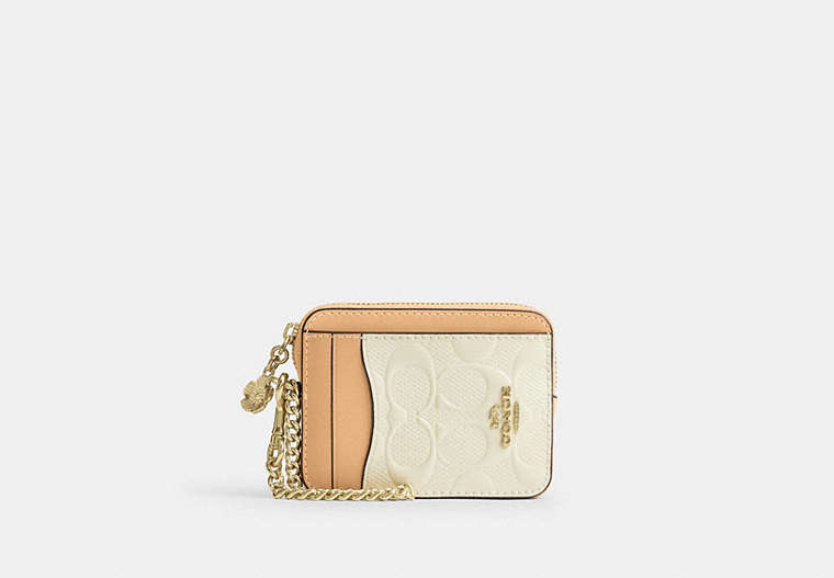 COACH® Women's Tarjetero Con Cremallera De Piel De Firma Con Charm en Amarillo | Cuir
