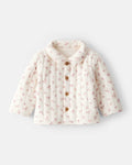 Chaqueta acolchada marfil con estampado floral