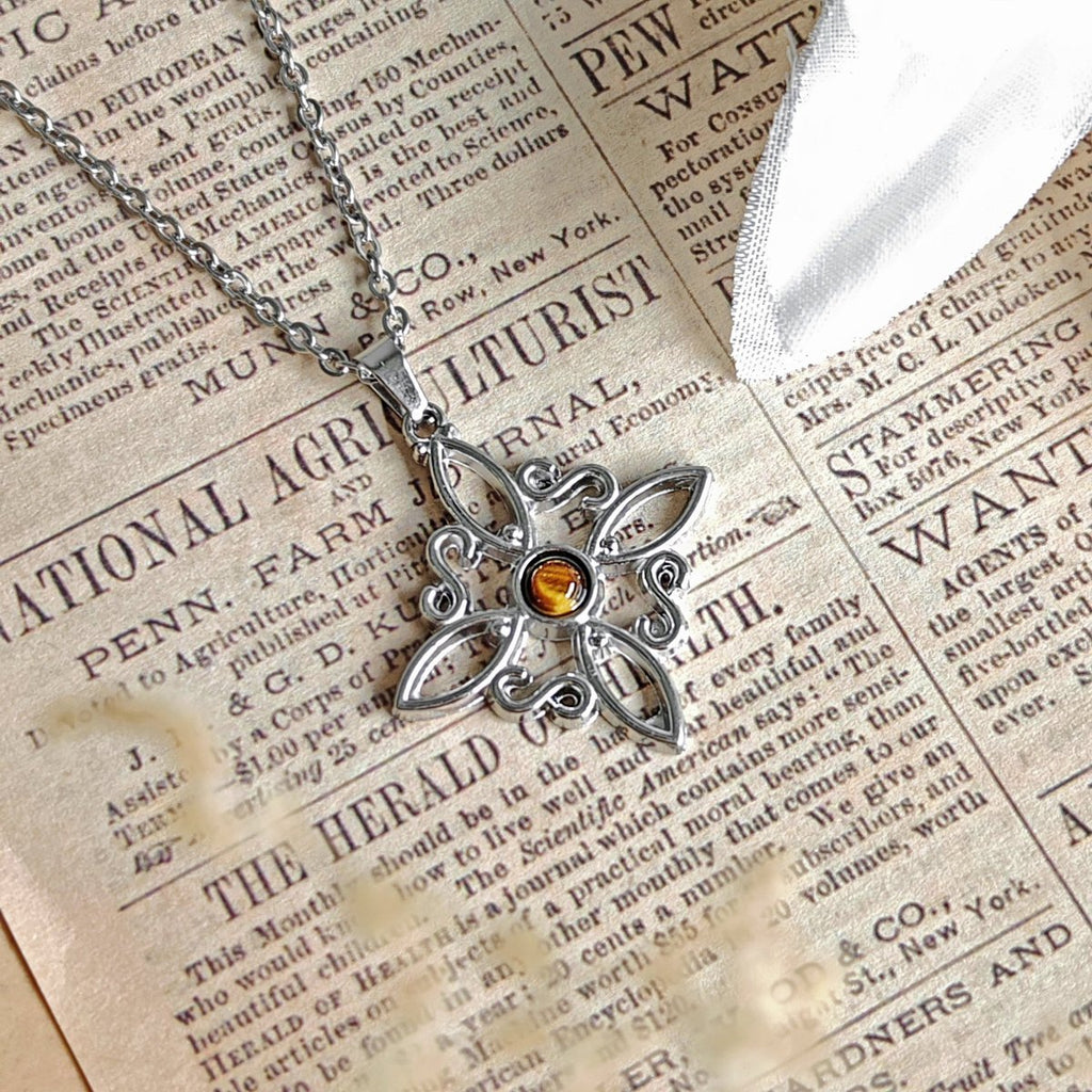 Collar Nudo de Bruja Acero Inox. con Ojo de Tigre