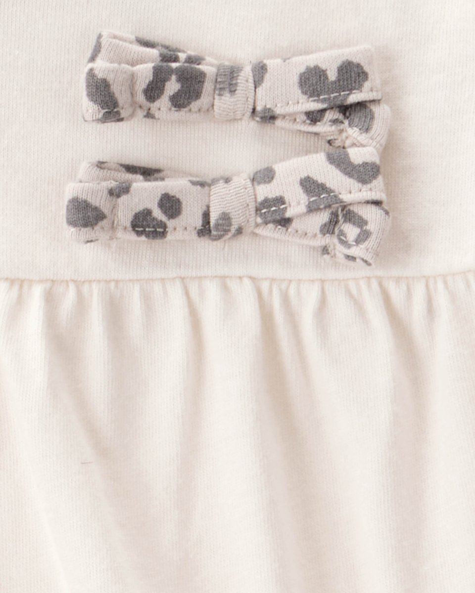 Conjunto 2 piezas con body de lazos y pantalón leopardo