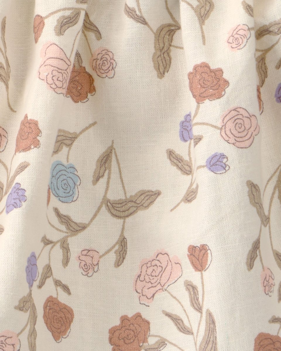 Conjunto tres piezas blusa y cubrepañal con lazo de lino y algodón, diseño floral