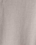 Conjunto tres piezas chaleco con oso, body y pantalón marfil
