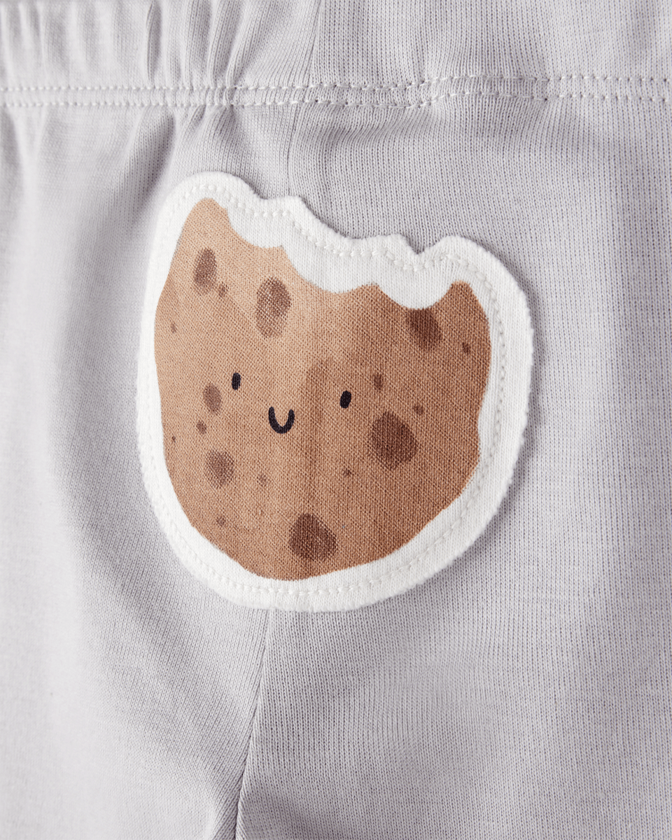 Conjunto tres piezas pantalón y dos bodies diseño galletitas