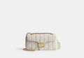COACH® Women's Bolso de hombro Tabby 26 con acolchado en Blanco | Cuir