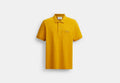 COACH® Men's Polo Clásico De Carruaje Y Caballos En Algodón Orgánico en Amarillo, Talla Mediano