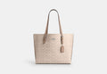 COACH® Women's Bolso tote Mollie de lona de firma en Beige | Pvc