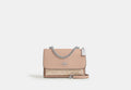 COACH® Women's Bolso cruzado Klare de lona de firma en Beige | Pvc