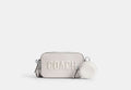 COACH® Men's Bolso cruzado Charter Slim con gráfico de Coach en Blanco