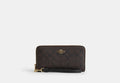 COACH® Women's Cartera Con Cremallera Perimetral Larga De Lona De Firma en Beige | Pvc