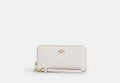 COACH® Women's Cartera Con Cremallera Perimetral Larga De Lona De Firma en Blanco | Pvc
