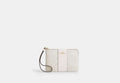 COACH® Women's Bolso pouch con cremallera lateral en lona de firma con franja en Blanco | Pvc