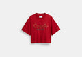 COACH® Women's Camiseta corta con script Coach en serpiente Año Nuevo en algodón orgánico en Rojo, Talla Mediano