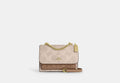 COACH® Women's Bolso cruzado Klare en lona de firma con bloques de color en Beige | Pvc