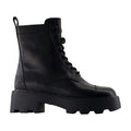 Tory Burch Monogram-embossed Lug Sole Ankle Boot — Black