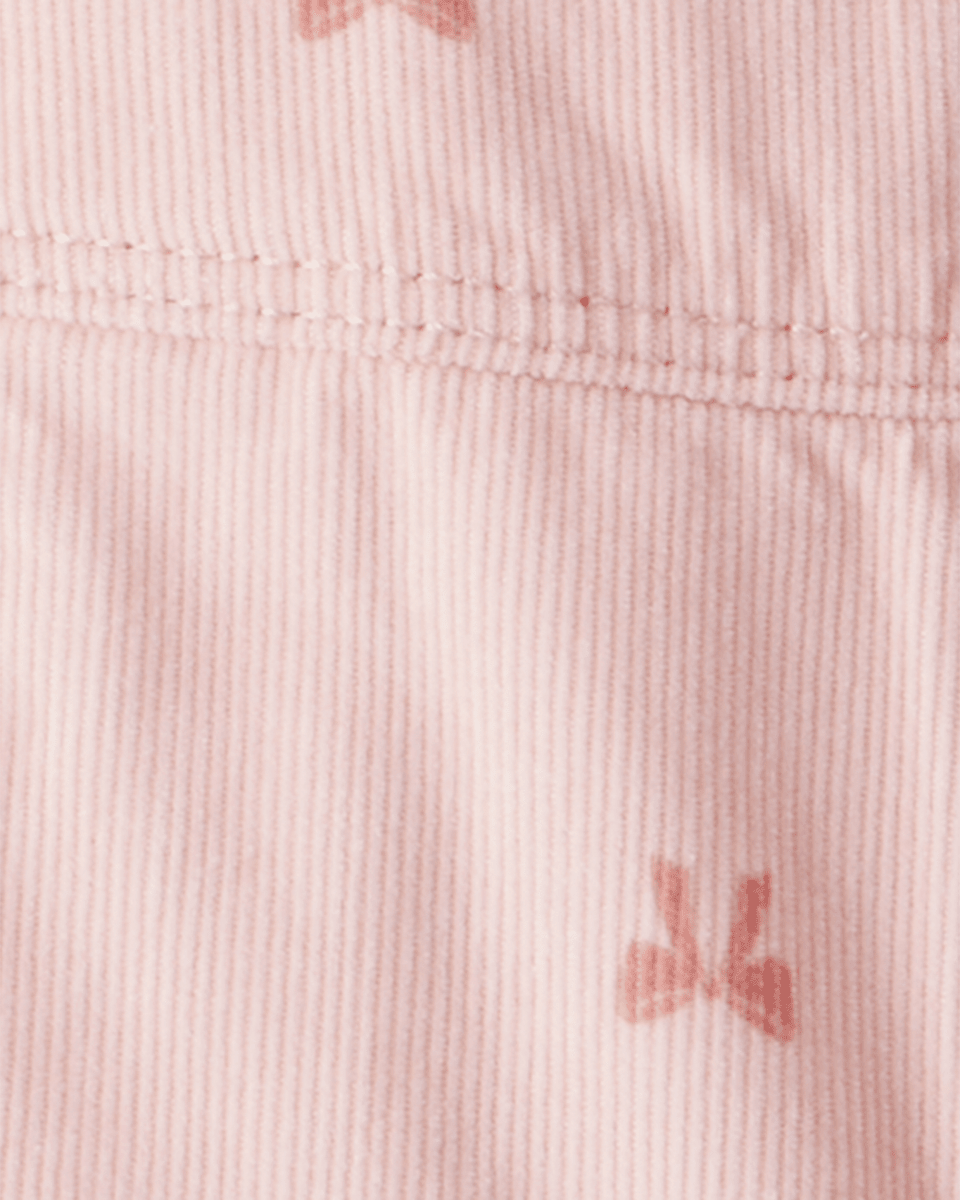 Peto de pana con lazo estampado rosa