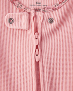 Pijama enterizo con pies y ribete floral en algodón acanalado