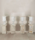 Set of Four 19th Century French Cast Iron Urns on 19th C Stone Plinths By Sister Parish Design
